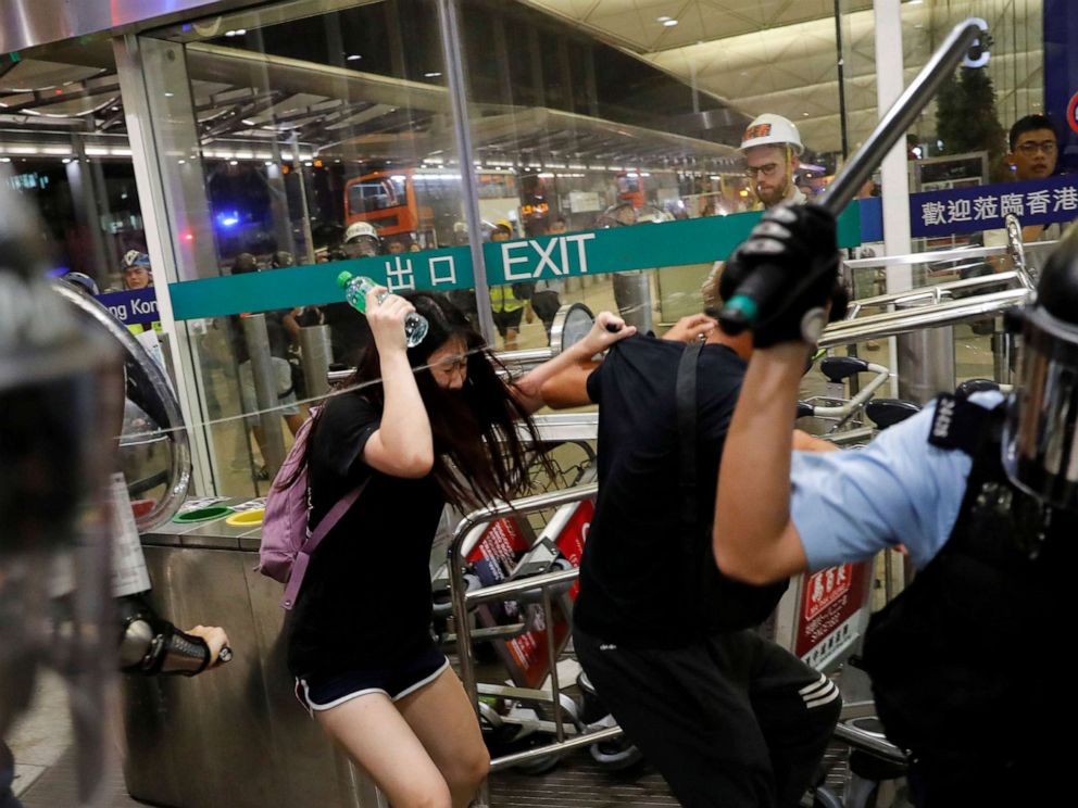 PHOTO: Riot police use pepper spray to disperse protesters during a mass demonstration at the Hong Kong International Airport, in Hong Kong, Aug. 13, 2019.