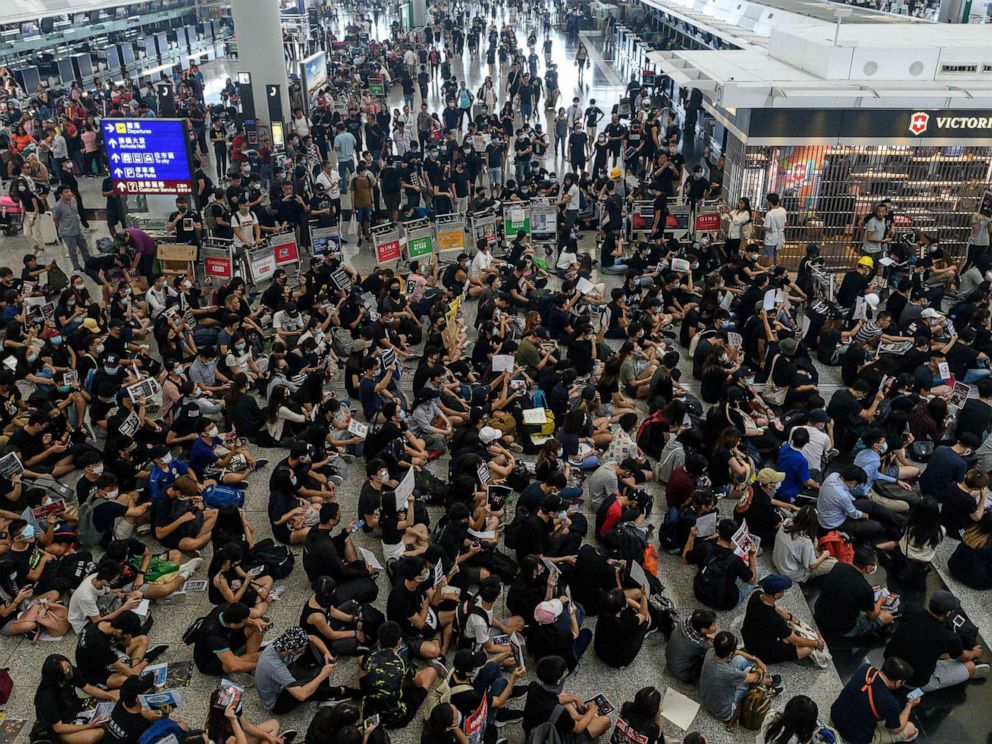 PHOTO: Hong Kong protesters block access to the departure gates during another demonstration at Hong Kongs international airport on Aug. 13, 2019.