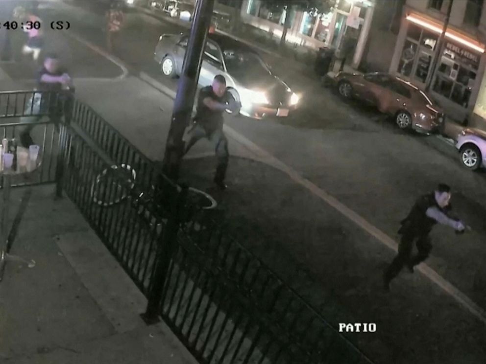 PHOTO: Police officers approach the scene of a mass shooting with weapons drawn in a still image from surveillance video released by police in Dayton, Ohio, Aug. 4, 2019.