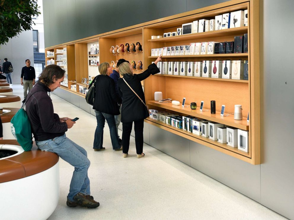 PHOTO: In this Sept. 12, 2018 file photo, customers shop for accessories at the Apple Store in San Francisco.
