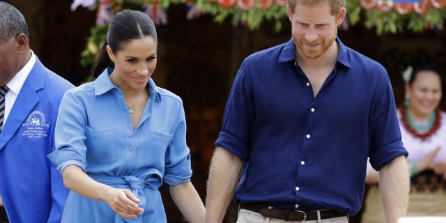 Britain's Prince Harry and Meghan, Duchess of Sussex smile during a visit to Tupou College in Tonga, Friday, Oct. 26, 2018. Prince Harry and his wife Meghan are on day eleven of their 16-day tour of Australia and the South Pacific.