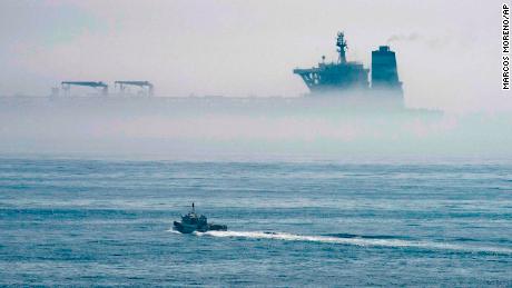 The Grace 1 supertanker looms among the sea fog off the coast of Gibraltar.  