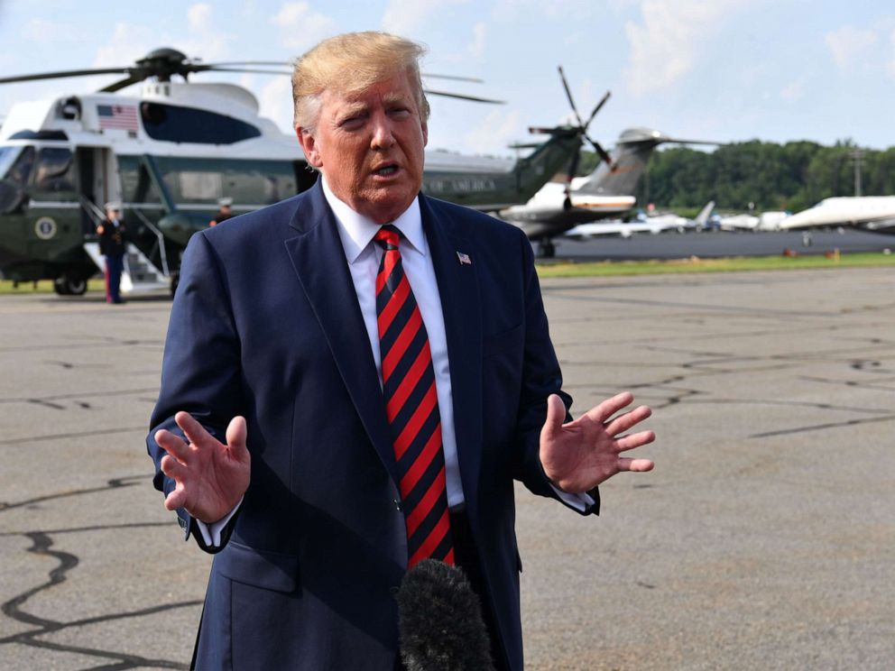 PHOTO: US President Donald Trump speaks to the press before boarding Air Force One in Morristown, New Jersey, on August 18, 2019.