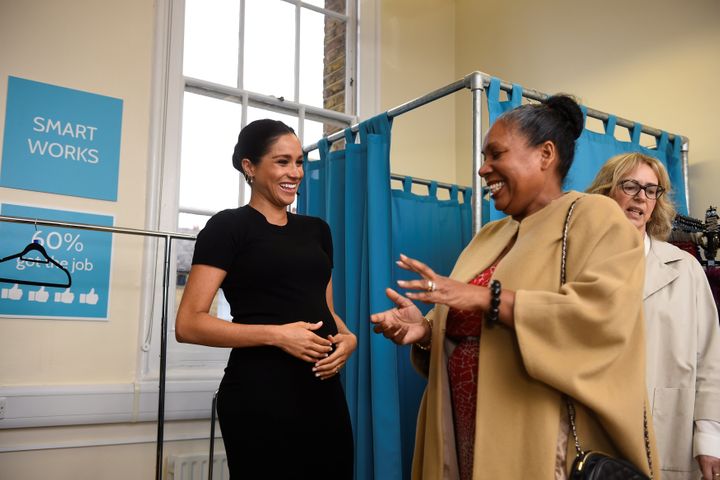 Meghan picks out clothes with Patsy Wardally during her visit to Smart Works at St. Charles Hospital.