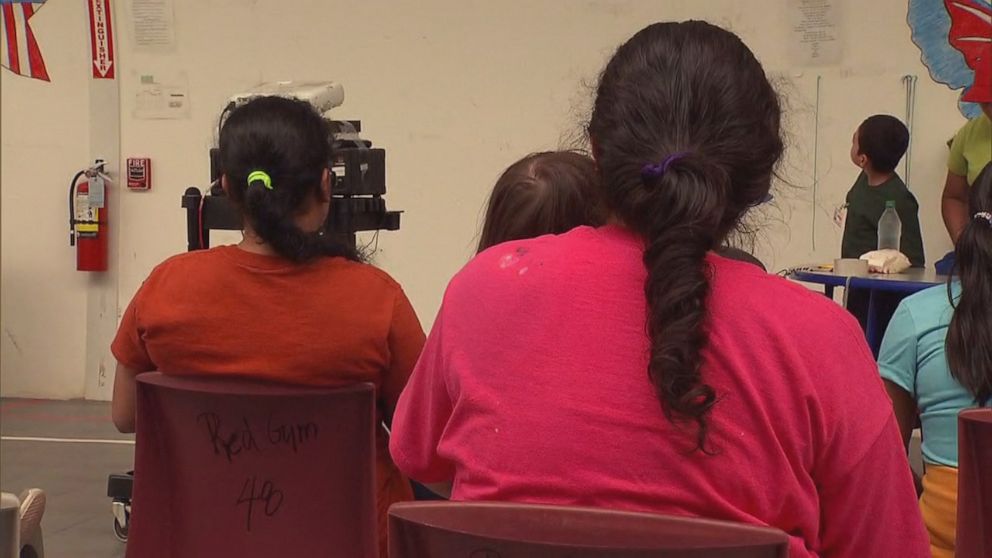 PHOTO: Women and children watch the movie Coco in a multi-purpose room at the Immigration and Customs Enforcement family detention center in Dilley, Texas, on August 23, 2019.
