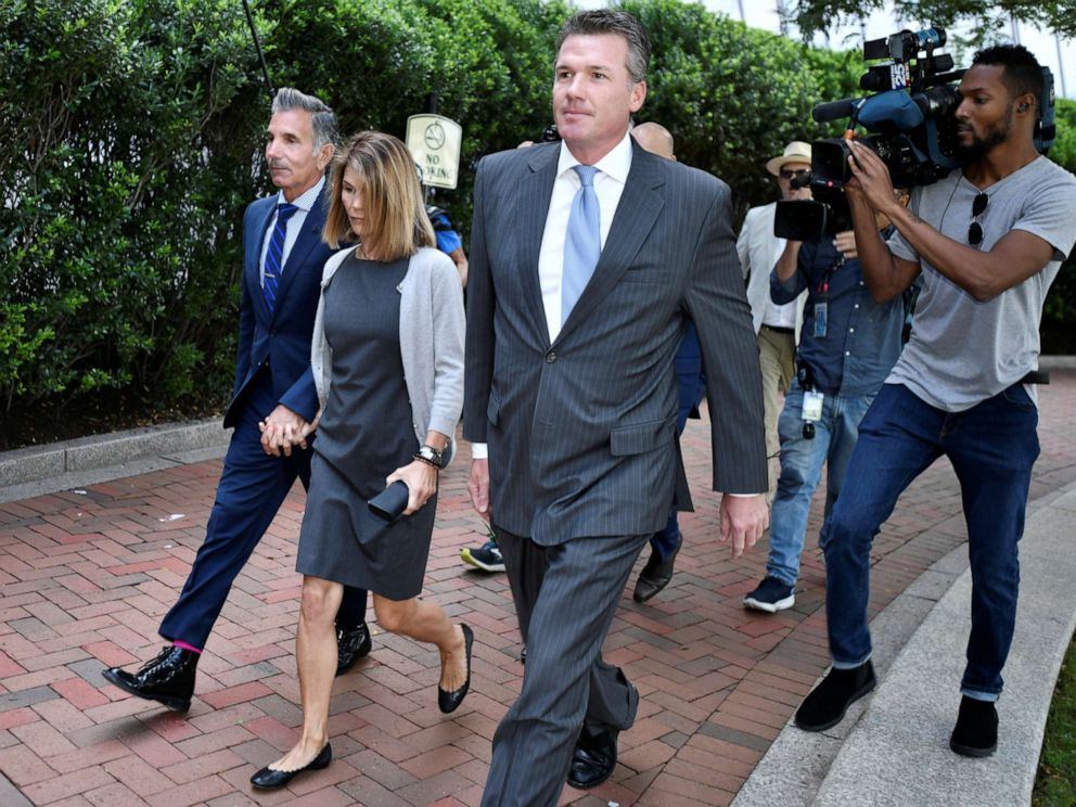 PHOTO: Actress Lori Loughlin and her husband, Mossimo Giannulli, arrive at the federal courthouse for a hearing on charges in a nationwide college admissions cheating scheme in Boston, Aug. 27, 2019.