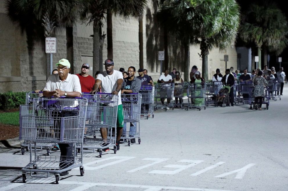 PHOTO: Shoppers wait in a long line for a Sams Club store to open before sunrise, as people rushed to buy supplies ahead of the arrival of Hurricane Dorian in Kissimmee, Florida, U.S. August 30, 2019.