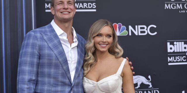 Rob Gronkowski and Camille Kostek arrive at the Billboard Music Awards on May 1, 2019, at the MGM Grand Garden Arena in Las Vegas.