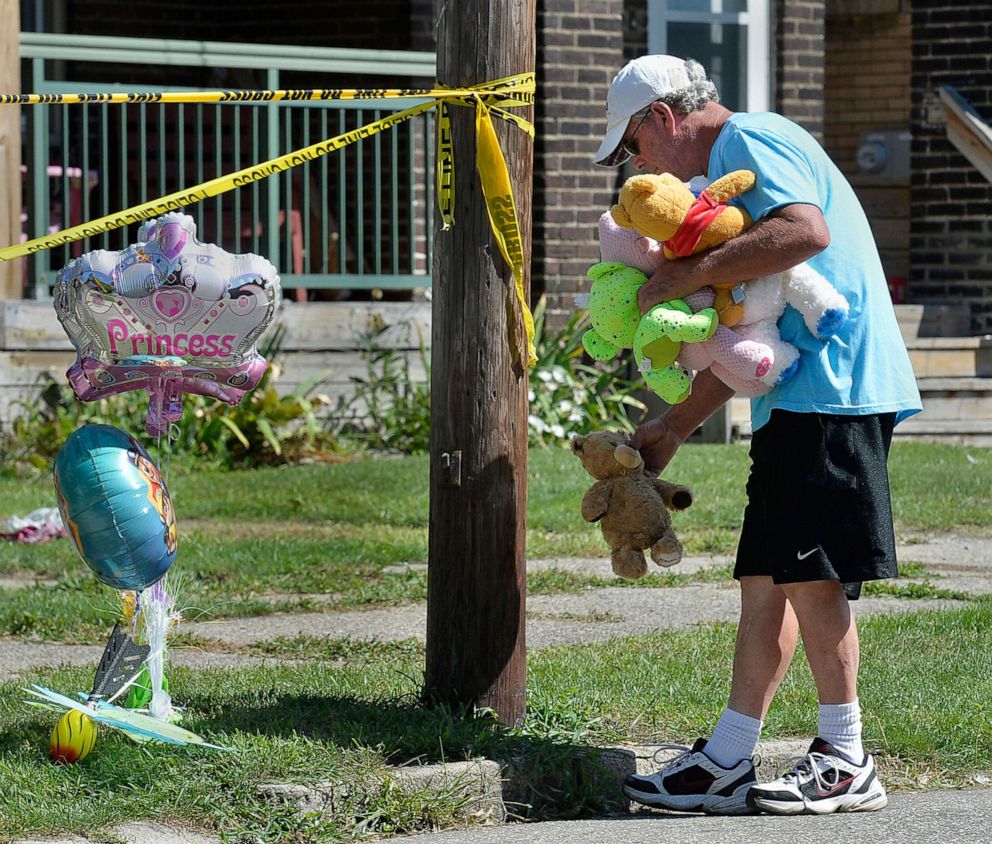 PHOTO: Paul Laughlin, 57, places stuffed animals outside a home at 1248 West 11th St. in Erie, Pa., where multiple people died in an early-morning fire, Aug. 11, 2019.