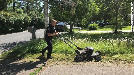 This officer was checking on the welfare of an elderly woman when he noticed her overgrown lawn. So he mowed her grass