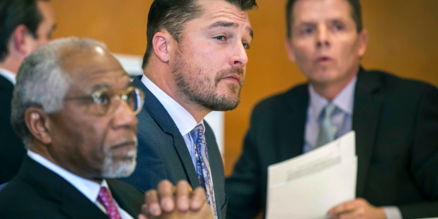 FILE - In this Nov. 27, 2017, file photo, Chris Soules, center, listens during a hearing in court in Independence, Iowa.