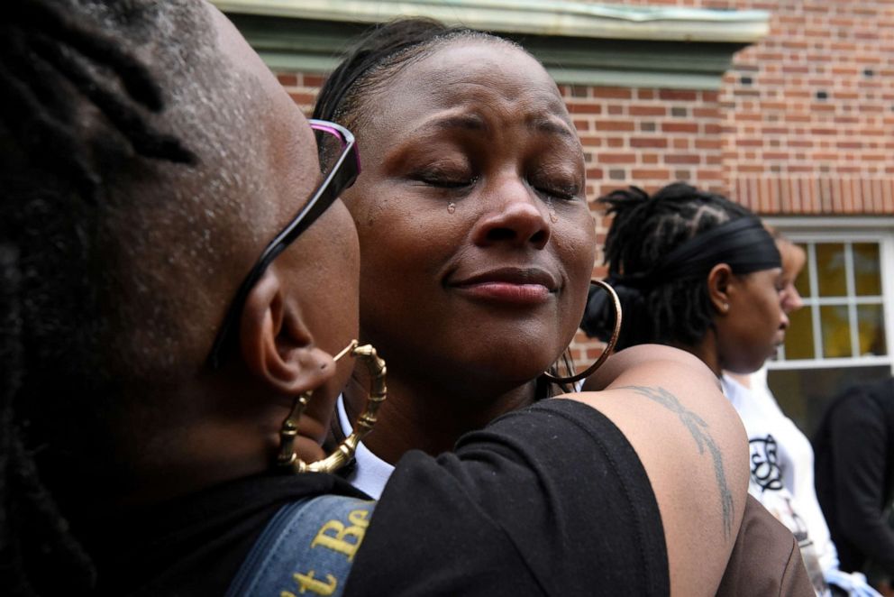 PHOTO: Blondina Bean is comforted while she cries at a memorial for her son, George Phillips, who was a victim of gun homicide at the age of 19, in Baltimore, Maryland, U.S., May 11, 2019.