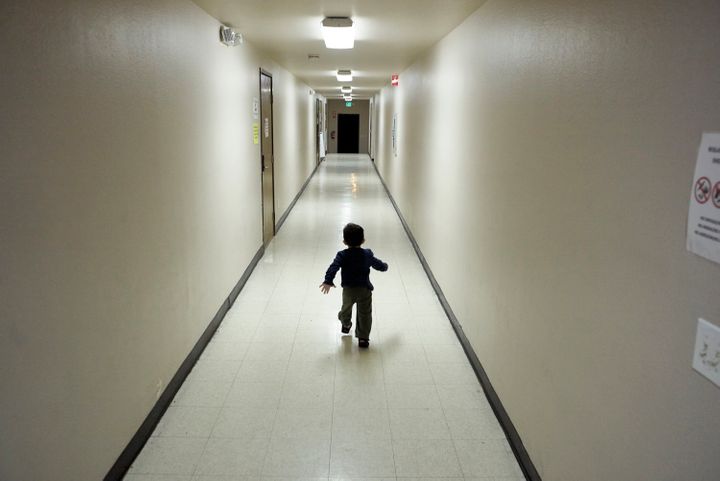 In this Dec. 11, 2018, file photo, an asylum-seeking boy from Central America runs down a hallway after arriving from an immi
