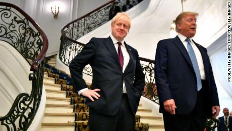 US President Donald Trump and Britain&#39;s Prime Minister Boris Johnson arrive for a breakfast meeting during the G7 on Sunday.