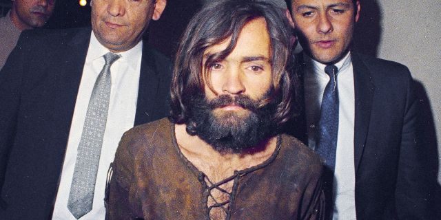 Charles Manson is escorted to his arraignment on conspiracy-murder charges in connection with the Sharon Tate murder case in Los Angeles. (AP Photo/File)