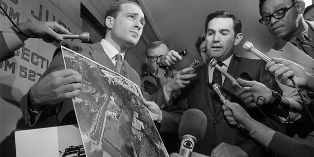 Deputy District Attorneys Aaron Stovitz (left) and Vince Bugliosi display an aerial photograph of the home of Leno and Rosemary LaBianca, 1969. — Getty