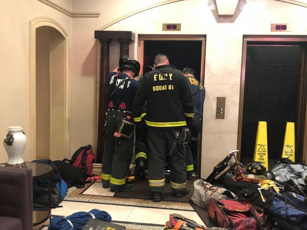 PHOTO: New York Fire Department members investigate an incident with an elevator in an apartment building in New York city.