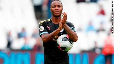 Raheem Sterling takes the match ball after scoring a hat-trick.