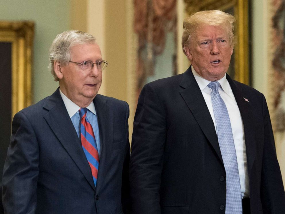 PHOTO: President Donald Trump walks with Senate Majority Leader Mitch McConnell at the Capitol on May 15, 2018, in Washington.