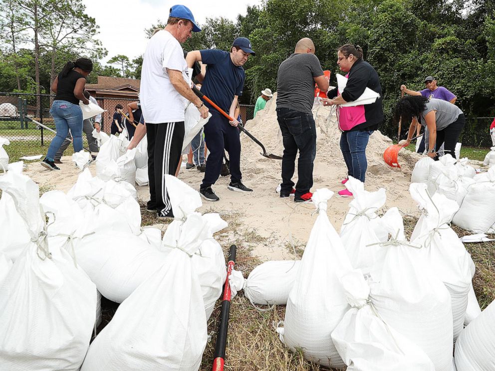 PHOTO: Dozens of Orange County residents fill sandbags in advance of Hurricane Dorian at Blanchard Park in Orlando, Fla. on Aug. 28, 2019.