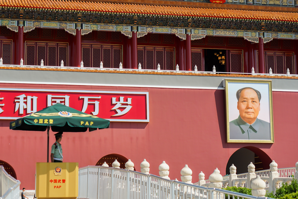 Tiananmen Square in Beijing, with a portrait of Mao Zedong at right.