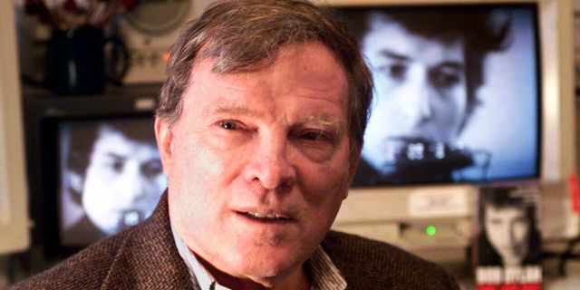 Documentary filmmaker D.A. Pennebaker is flanked by 35-year-old images of Bob Dylan as Pennebaker sits in his New York editing suite, Jan. 27, 2000. (Associated Press)