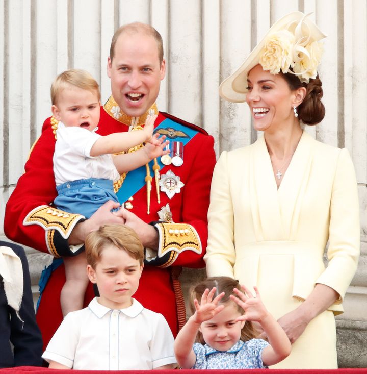 The family watch a flypast from the balcony of Buckingham Palace during Trooping the Colour, the Queen's annual birthday para