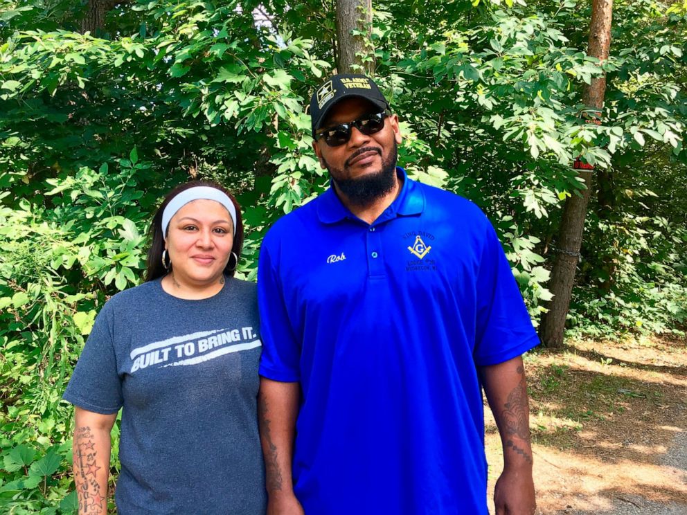 PHOTO: This undated photo shows Reyna and Rob Mathis, who found racist memorabilia in a home owned by a Muskegon police officer, pose for a portrait outside their home in Muskegon, Mich.