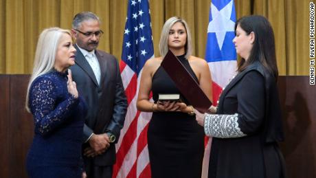 Justice Secretary Wanda Vazquez is sworn in as governor of Puerto Rico by Supreme Court Justice Maite Oronoz in San Juan on Wednesday. 