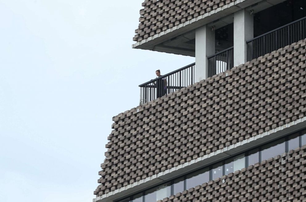 PHOTO: A police officer looks out from the viewing platform at the Tate Modern art gallery in London after a six-year-old boy was thrown from the tenth floor viewing platform, Aug. 4, 2019.