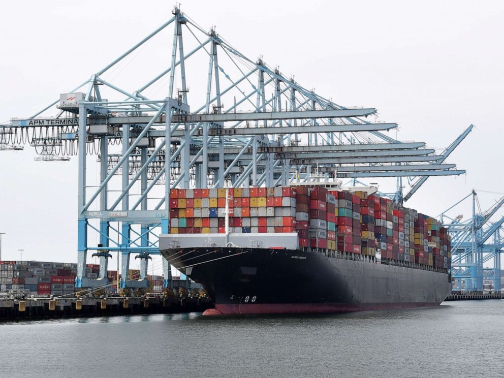 PHOTO: In this May 14, 2019, file photo, shipping containers are unloaded at the Port of Los Angeles in Long Beach, Calif.
