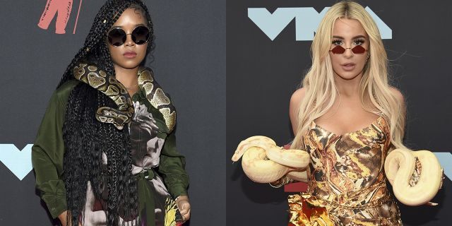 Tana Mongeau, right, and H.E.R. arrive at the MTV Video Music Awards