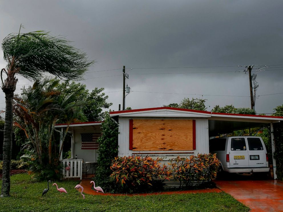 PHOTO: A van is parked near a home in the Tropical Acres Mobile Home Park, an area that is under mandatory evacuation with Hurricane Dorian off the coast of Florida, in Jensen Beach, Fla., Sept. 2, 2019.