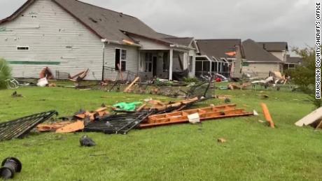 Pieces of roofs and siding were torn off homes Thursday morning in Carolina Shores, North Carolina, about 40 miles southwest of Wilmington.