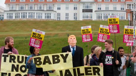 Activists from Stand Up to Racism Scotland (SUTR) stage a protest at the Trump Turnberry resort ahead of the US president&#39;s arrival in the UK. 