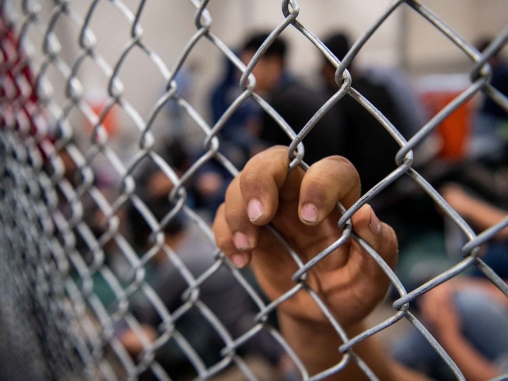PHOTO: Male minors sit and wait inside the US Border Patrol Central Processing Center in McAllen, Texas on Aug. 12, 2019.