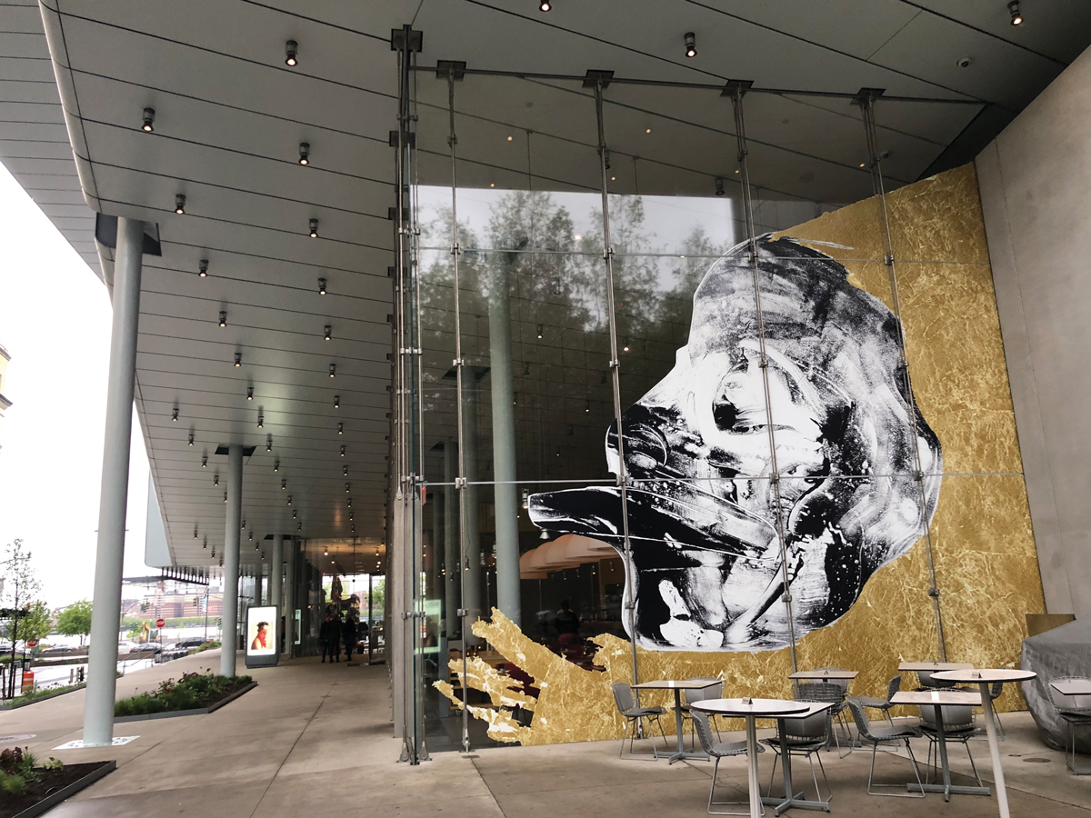 Nicholas Galanin's 'Let them enter dancing and showing their faces: Shaman,' 2019, is installed on a ground-floor window at the Whitney Museum in New York. 