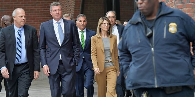 Lori Loughlin exits the John Joseph Moakley U.S. Courthouse after appearing in Federal Court to answer charges stemming from college admissions scandal on April 3, 2019 in Boston, Massachusetts. (Photo by Paul Marotta/Getty Images)