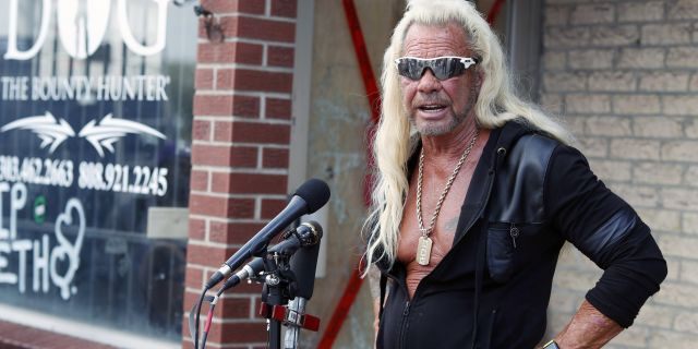 Duane "Dog the Bounty Hunter" Chapman talks to reporters outside his storefront that was burglarized Friday, Aug. 2, 2019, in Edgewater, Colo.