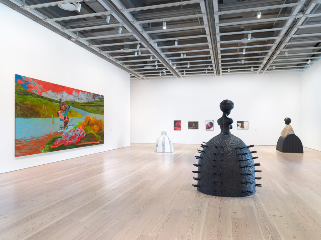 Installation view of the 2019 Whitney Biennial, showing Janiva Ellis's Uh Oh, Look Who Got Wet, 2019, at left; sculptures by Simone Leigh, foreground; and photographs by Heji Shin, background.