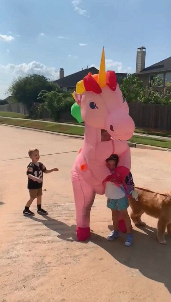 PHOTO: Dad Chris Scandridge filmed last week as his wife Somer Scandridge danced up the block in her giant, pink costume to greet 6-year-old Madison.