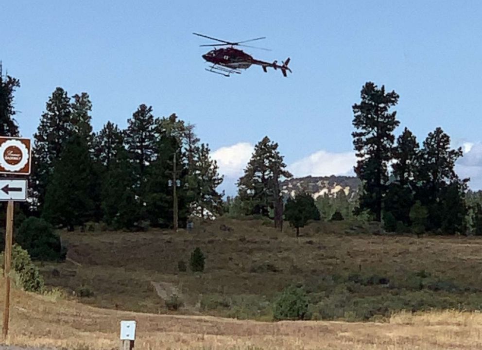 PHOTO: A helicopter flies near the scene where a tour bus crashed near Bryce Canyon National Park on SR-12 in Utah, Sept. 20, 2019.