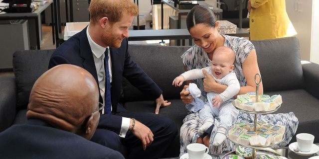 Britain's Duke and Duchess of Sussex, Prince Harry and his wife Meghan Markle hold their baby son Archie as they meet with Archbishop Desmond Tutu at the Tutu Legacy Foundation in Cape Town on Sep. 25, 2019. The British royal couple are on a 10-day tour of southern Africa -- their first official visit as a family since their son Archie was born in May.