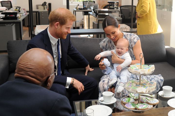 Meghan holds their baby son Archie as they meet with Archbishop Desmond Tutu at the Tutu Legacy Foundation in Cape Town on Se