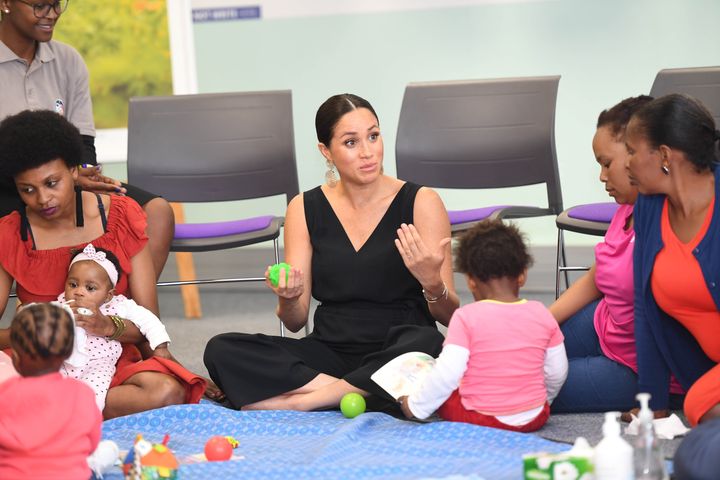 Meghan meets health workers and client families during a visit to mothers2mothers.