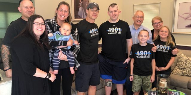 Cem Duzel and his family with John Cena (center with hat)