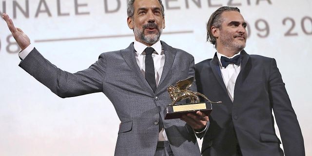Director Todd Phillips, left, holds the Golden Lion for Best Film for "Joker," joined by lead actor Joaquin Phoenix at the closing ceremony of the 76th edition of the Venice Film Festival, Venice, Italy, Saturday, Sept. 7, 2019.