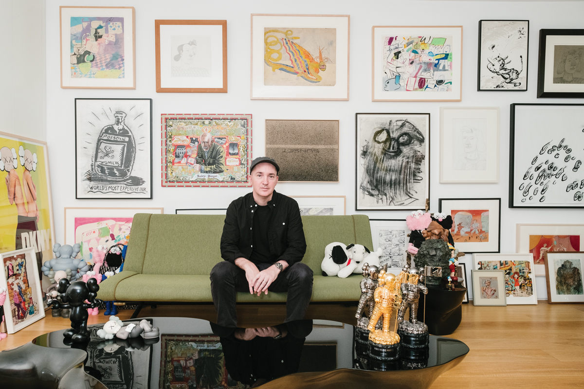 Brian Donnelly in his studio in Brooklyn on a sofa designed by Osvaldo Borsani in 1954 surrounded by riches from his collection. PHOTO: DONALD STAHL FOR ARTNEWS