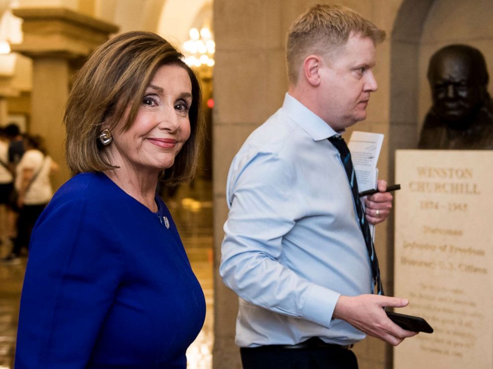 PHOTO: Speaker of the House Nancy Pelosi walks with her Deputy Chief of Staff Drew Hamill past the Sir Winston Churchill bust as she exits the Capitol on Sept. 24, 2019.