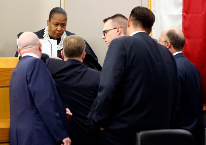 Judge Tammy Kemp (facing) called prosecutors and defense attorneys to the bench during pretrial arguments in the Amber Guyger murder trial in the 204th District Court at the Frank Crowley Courts Building in Dallas, Monday, September 23, 2019. Guyger shot and killed Botham Jean, an unarmed 26-year-old neighbor in his own apartment last year. She told police she thought his apartment was her own and that he was an intruder. (Tom Fox/The Dallas Morning News/Pool) thegrio.com